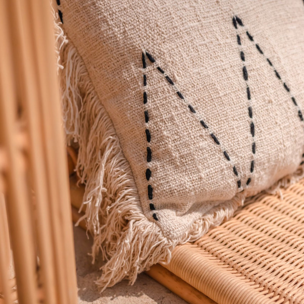Black and white handwoven cotton cushion cover with zigzag pattern and fringes