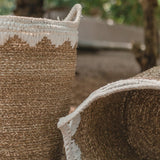 White woven seagrass storage basket with handles
