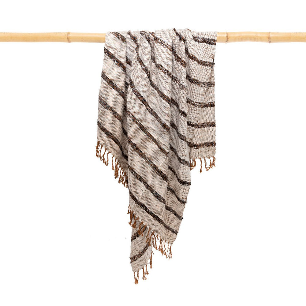 White fringed cotton throw with charcoal stripes and terracotta tassels