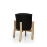 Black terracotta planter on teak branch stand