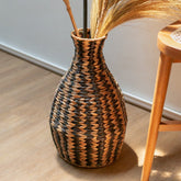Black and natural woven water hyacinth vase