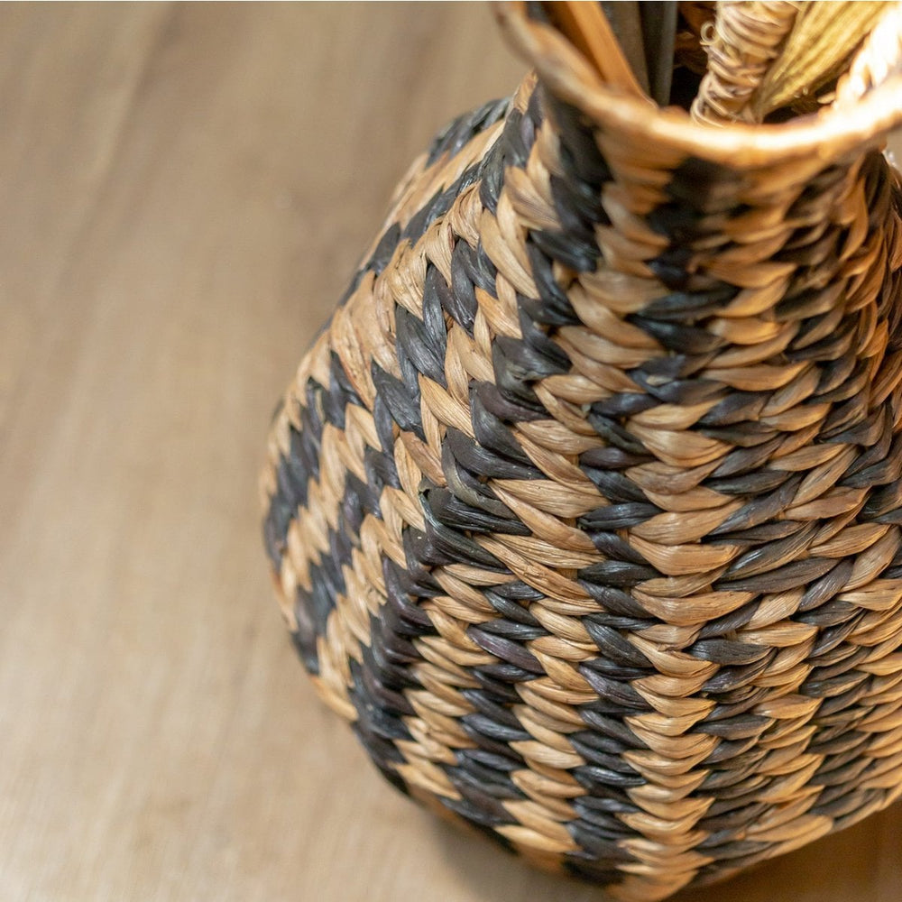 Black and natural woven water hyacinth vase