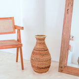 Beige and brown handwoven banana fiber vase with raffia accents