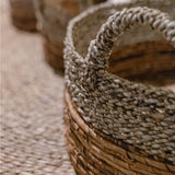 Beige and brown woven seagrass and banana fibre storage basket