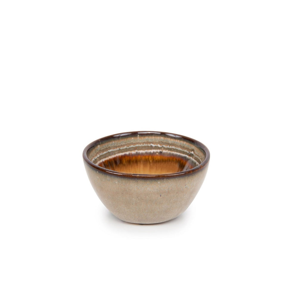 Ceramic bowl with brown interior on a white background