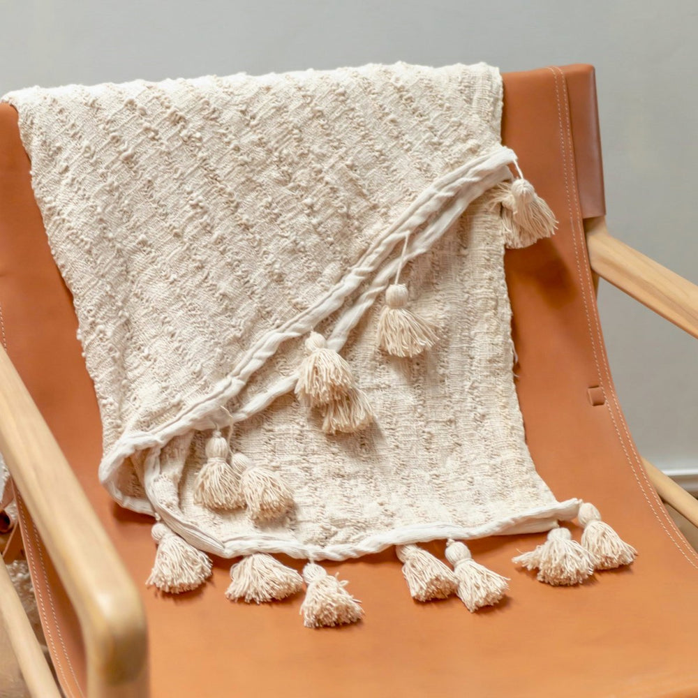Beige handwoven cotton blanket with striped weave