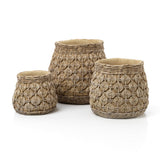 Three woven baskets with geometric patterns on a white background