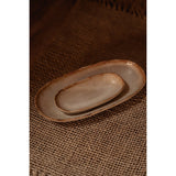 Two ceramic plates on a textured brown surface